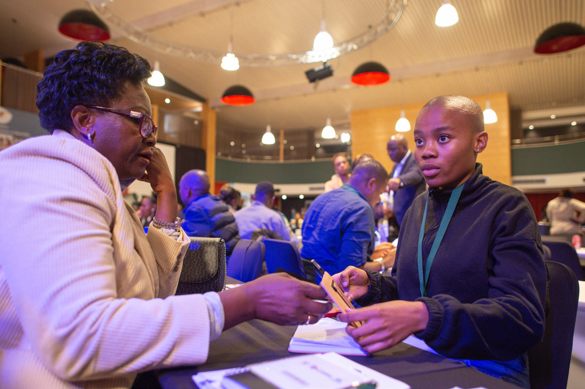 A focused one-to-one business conversation at a tourism roadshow