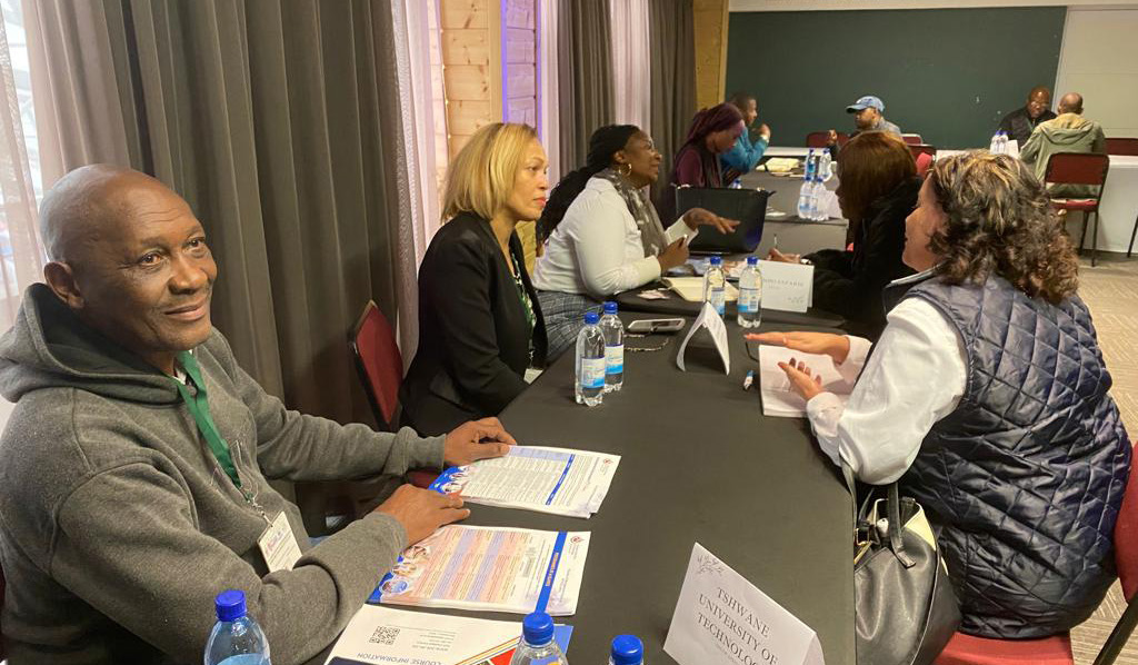 Tourism delegates meeting at a table