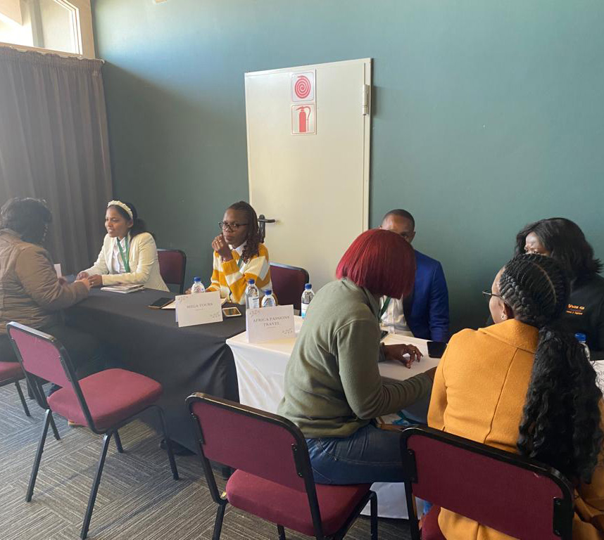 Delegates holding a meeting at a tourism roadshow